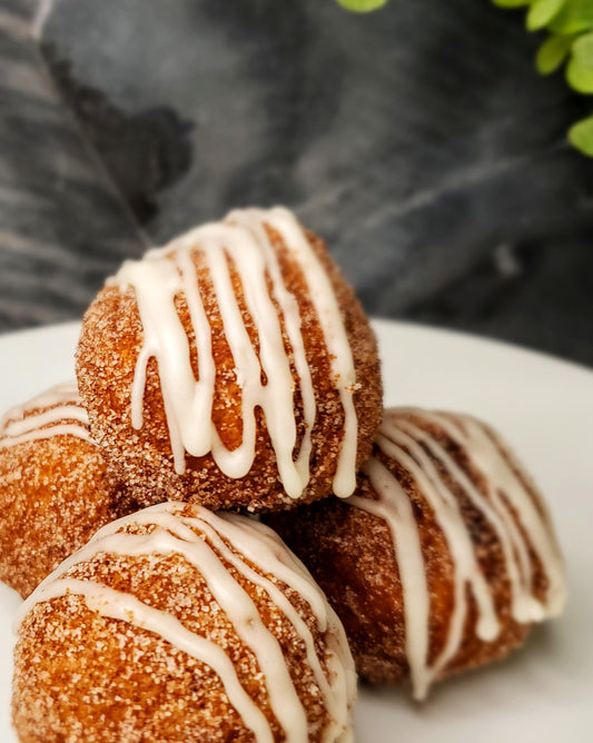 Full flavored baked apples nested in a flaky, buttery fried crust.  Each Apple Pie Ball is coated with cinnamon sugar and lightly iced.  Oh! so cozy and full of love. 