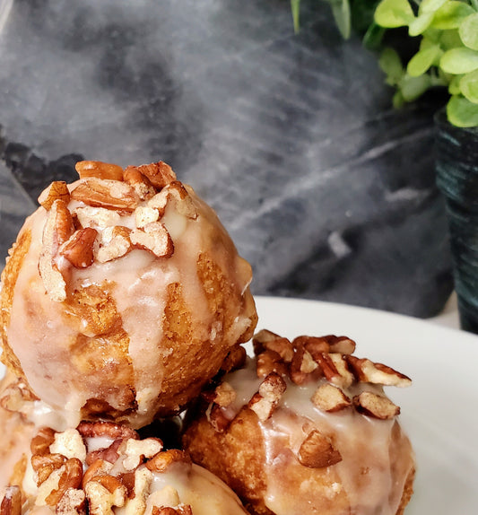 Sweet maple custard filled, with a perfect balance of pecans and flaky crust in every bite. You won't find any corn syrup here, and we guarantee you will love it!    Each Pecan Pie Ball is lightly coated with a maple glaze and topped with chopped pecans.  This one will make your toes curl!
